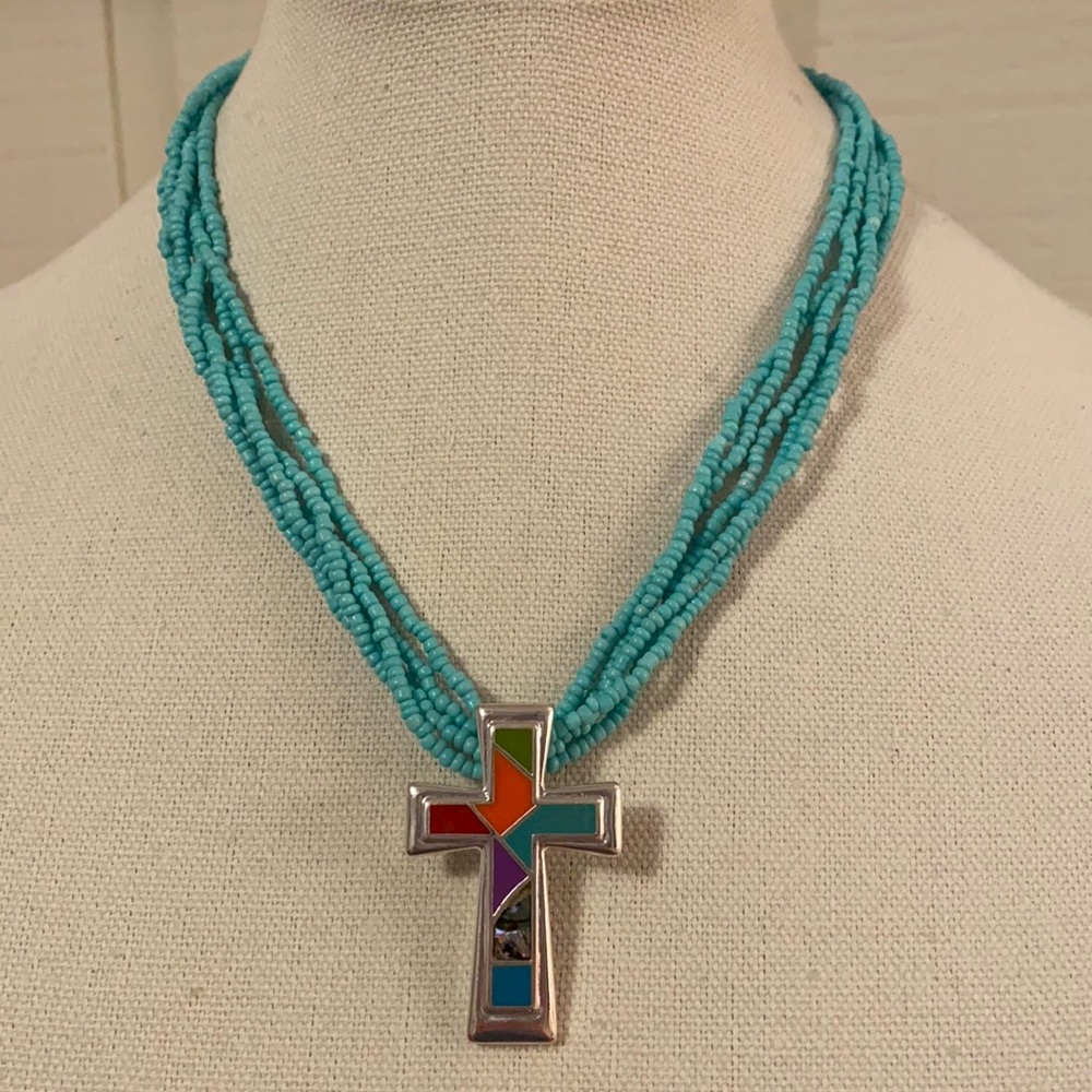 Gorgeous inlaid cross on a blue bead necklace